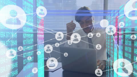 Businessman in Office Engaging with Network Graphics