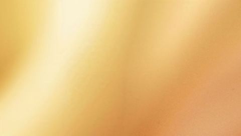 Glowing golden-beige satin gradient flowing with soft light and subtle texture