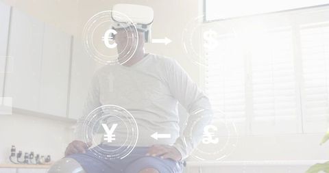 Mature man exploring virtual currency exchange with vr headset in sunlit kitchen