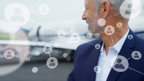 Businessman Connected by Digital Networks Near Aircraft