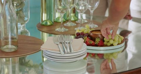 Elegant Table Setting with Fruits and Glassware at Dinner Party