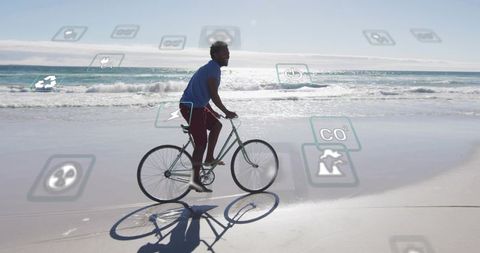 Cyclist riding bicycle on sunlit beach with eco icons overlay and coastal reflections