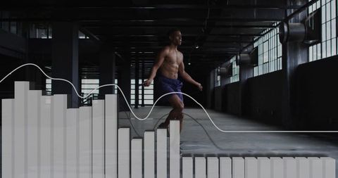Athletic Man Skipping Rope in Industrial Gym with Financial Overlays