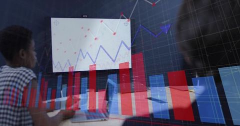 Professional Analyzing Business Graphs in Conference Room with Technology Overlay