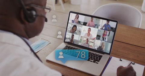 Businessman Engaged in Virtual Meeting with Data Processing Overlay