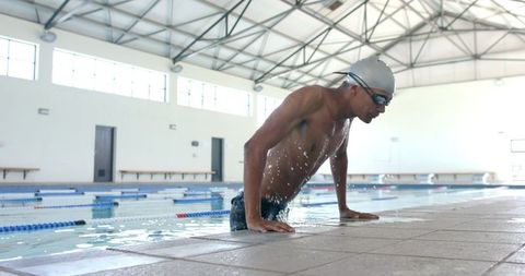 Focused Male Swimmer Preparing for Intense Training - Download Free Stock Images Pikwizard.com