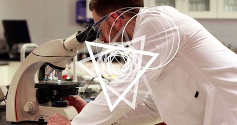 Scientist analyzing microbiology data through microscope