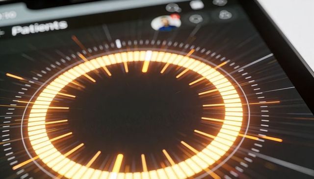 Orange radial dashboard on tablet for patient monitoring and medical analytics