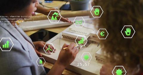Collaborative team sketching architectural scale model with augmented reality data overlays