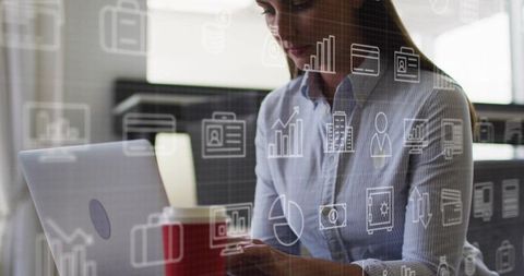 Businesswoman typing on laptop with analytics overlay in coworking office minimalist