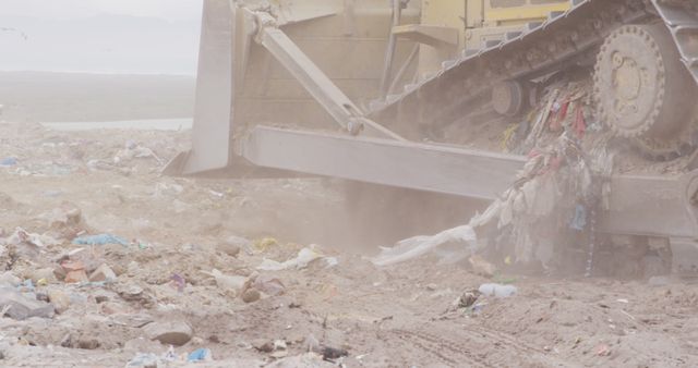 Close up of landfill with piles of litter and dozer. Landfill, waste, pollution and environment.