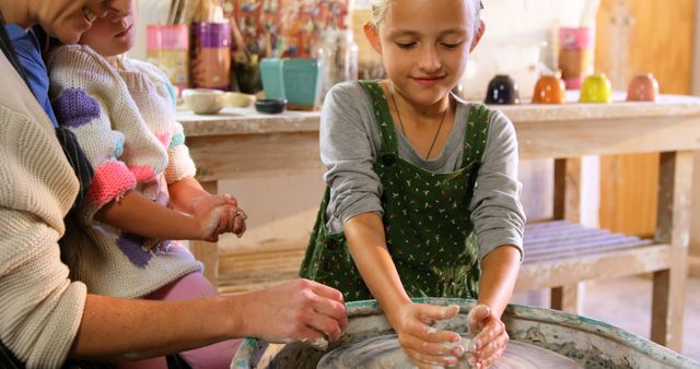 Young Girl Learning Pottery with Instructor at Art Studio - Download Free Stock Images Pikwizard.com