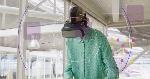Caucasian Woman Using VR Headset with Data Overlay in Office