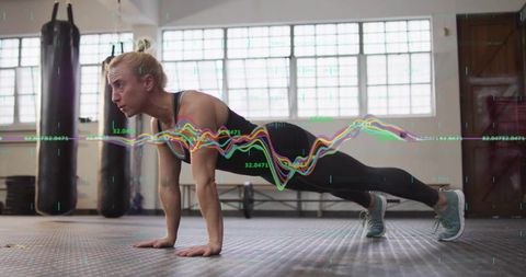 Woman Performing Push-Up in Gym with Biometric Waveform Overlay