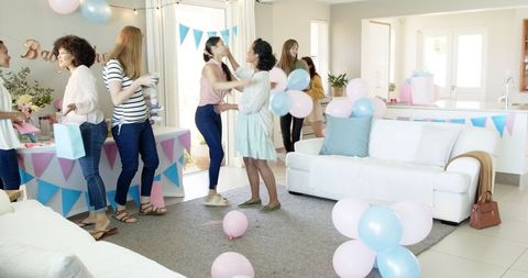 Joyful Baby Shower Celebration with Friends Sharing Gifts