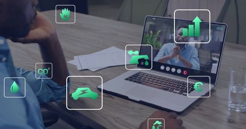 Remote video meeting discussing sustainability metrics with dashboard icons over workspace