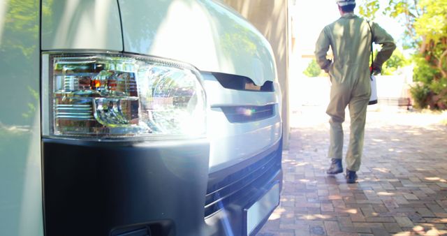 Delivery Driver Preparing for Route Near Cargo Van on Sunny Day - Download Free Stock Images Pikwizard.com