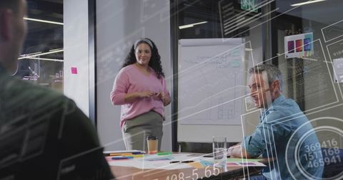 Business Meeting with Data Visualization Overlays and Flip Chart Presentation