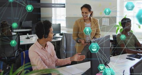 Headset Agent Collaborating and Mentoring Manager in Modern Open Office with Tech Network Overlay