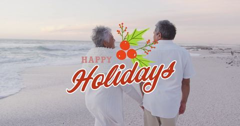 Happy senior couple celebrating christmas on beach