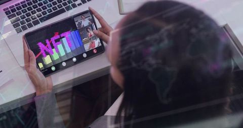 Businesswoman holding tablet viewing nft growth during virtual meeting