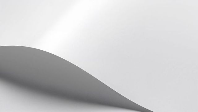 Curved paper-like sheet forming smooth arc with soft shadow minimal monochrome tone