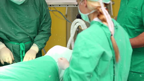 Snowfall Animation in Operating Room with Surgeons Performing Surgery