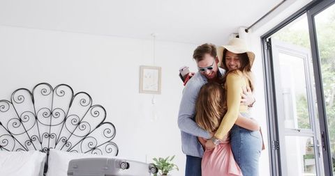 Happy Family Packing Suitcases for Adventure Holiday Departure