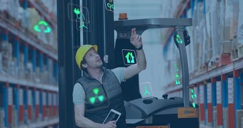 Forklift operator using tablet with AR overlays for smart warehouse inventory management