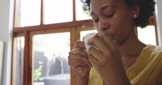 Young Woman Drinking Coffee by Window in Bright Morning Light - Download Free Stock Images Pikwizard.com