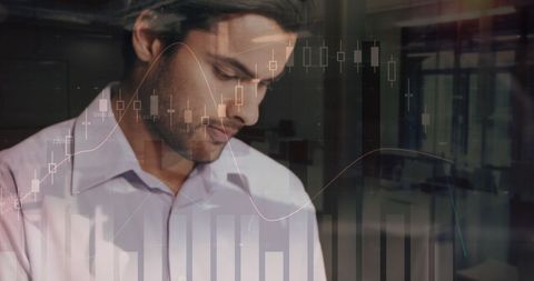 Businessman with data analytics graph overlay in modern office