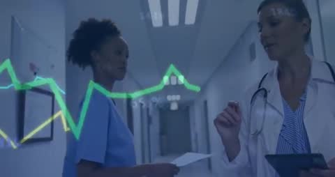 Doctors Analyzing Digital Charts in Hospital Corridor