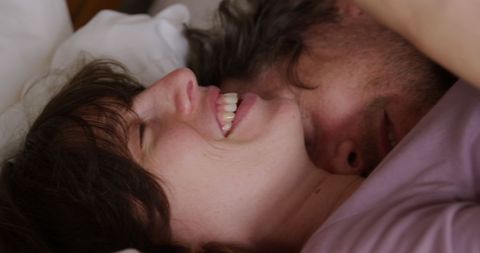 Joyful Couple Sharing Tender Moment in Cozy Home Setting