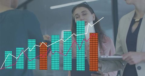 Business team analyzing growth charts during office meeting with tablet