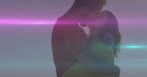 Silhouetted Couple Kiss Under Star-Splattered Sky with Neon Glow