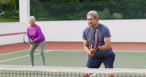 Senior couple enjoying tennis game for active lifestyle