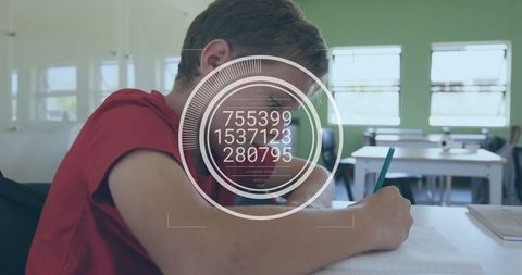 Writing student focusing on worksheet at classroom desk with hud data analytics overlay