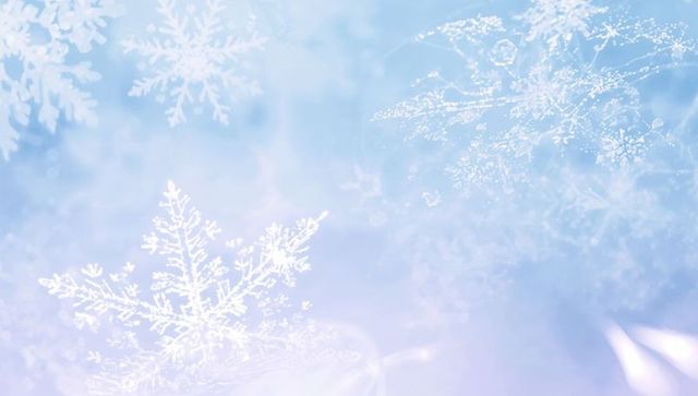 Glowing pastel snowflake background with frosty bokeh and delicate light flares