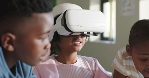 African American Teens Using Virtual Reality Headset for Classroom STEM Collaboration