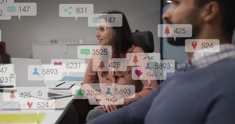 Woman leading team meeting with digital notification overlays and collaborative laptop tech