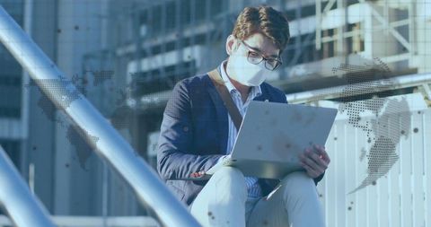 Business Professional Working Remotely on Laptop at Urban Terrace