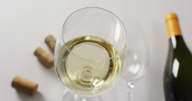 Close-Up of White Wine Glass with Bottle - Download Free Stock Images Pikwizard.com