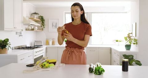 Woman Preparing Fresh Ingredients in Modern Kitchen Settings