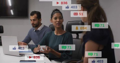 Businesswoman holding mug leading meeting with social notifications showing engagement metrics