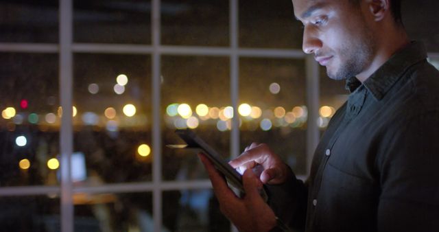 Young Professional Working on Tablet at Night in Office - Download Free Stock Images Pikwizard.com