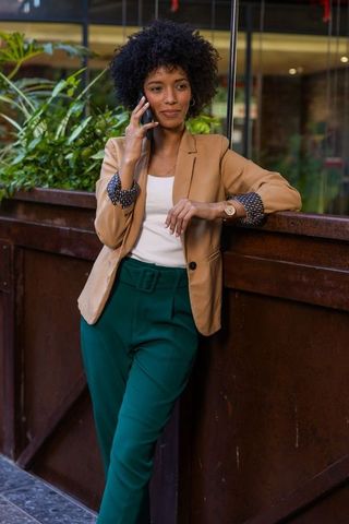 Professional Woman Communicating on Smartphone in Office Lobby