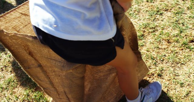 Child Participating in Outdoor Sack Race - Download Free Stock Images Pikwizard.com