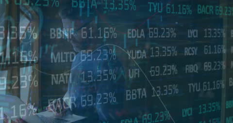 Businessman Analyzing Dynamic Stock Market Data on Laptop