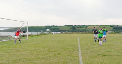 Youth Soccer Team Practicing Free Kick on Coastal Field