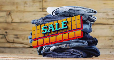 Denim jeans sale advertisement with wooden background